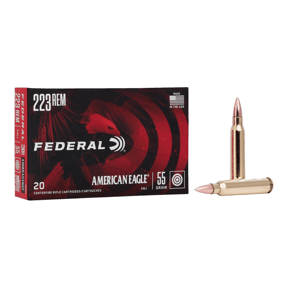 A red and black 20-cartridge box of Federal American Eagle 223 Rem 55 grain FMJ, with two cartridges beside it