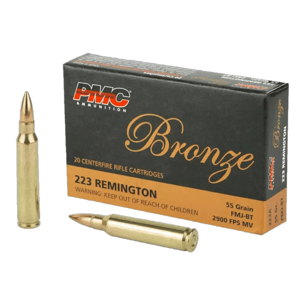 A black 20-cartridge box of PMC Bronze 223 Remington 55 grain FMJ-BT, with two cartridges beside it