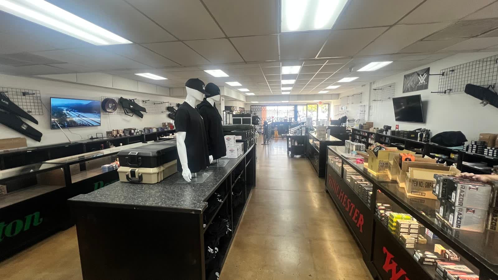 Long counters of boxed ammunition down the length of LAX Ammo San Diego in Kearny Mesa