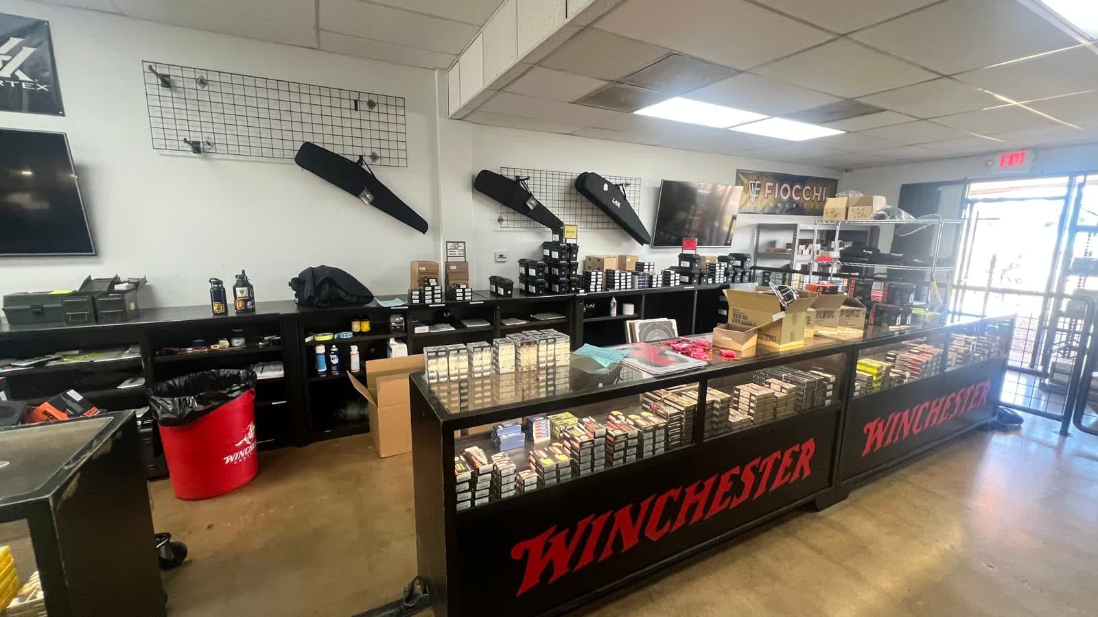 LAX tees and caps on the merchandise counter at LAX Ammo San Diego in Kearny Mesa